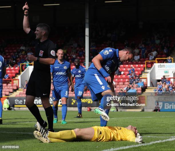 Sam Togwell of Eastleigh looks over a poleaxed Graham Stack of Eastleigh during the National League match between Leyton Orient and Eastleigh at The...