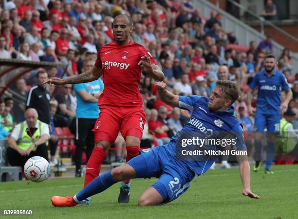 Jake Caprice of Leyton Orient is tackled by Callum Howe of Eastleigh during the National League match between Leyton Orient and Eastleigh at The...