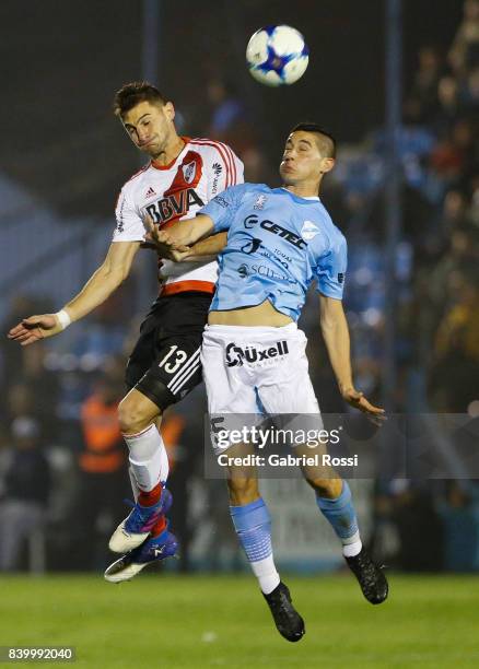 Lucas Alario of River Plate fights for the ball with Rodrigo De Ciancio of Temperley during a match between Temperley and River Plate as part of...