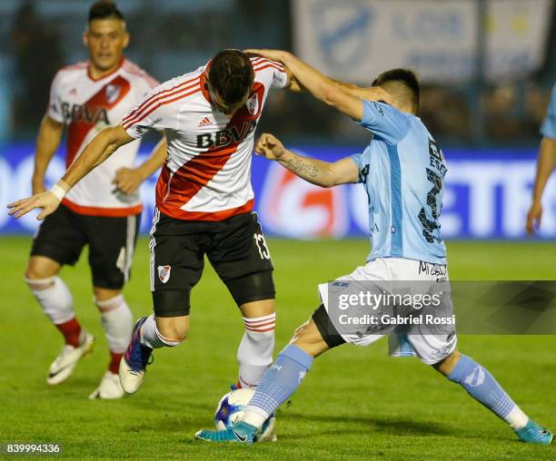 Lucas Alario of River Plate fights for the ball with Patricio Romero of Temperley during a match between Temperley and River Plate as part of first...