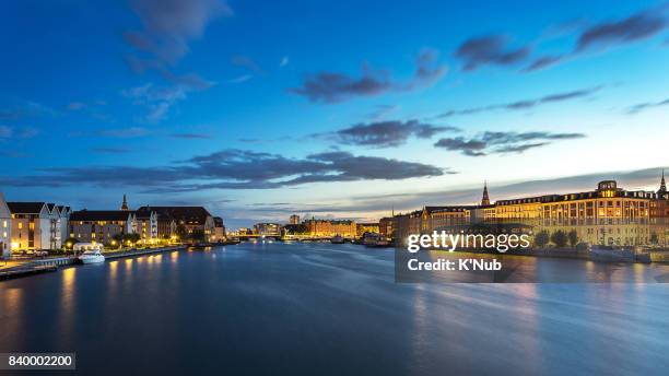 building along the river in copenhagen denmark - copenhagen night stock pictures, royalty-free photos & images