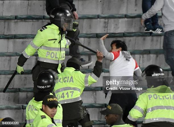 Fans clash with police officers during a match between Independiente Santa Fe and Millonarios as part of Liga Aguila II 2017 at Nemesio Camacho...
