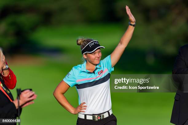 Brooke Henderson acknowledges the cheering crowd during the award ceremony after the final round of the Canadian Pacific Women's Open on August 27,...