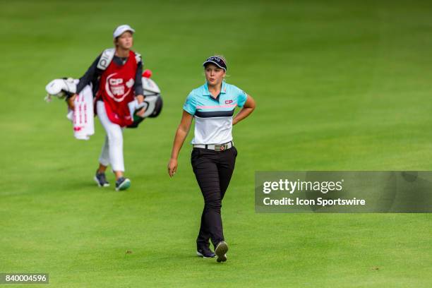 Brooke Henderson walks down the fairway of the 9th hole during the final round of the Canadian Pacific Women's Open on August 27, 2017 at The Ottawa...