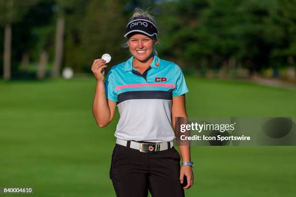 Brooke Henderson shows of the medal for lowest Canadian score after the final round of the Canadian Pacific Women's Open on August 27, 2017 at The...