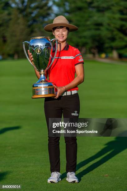 Canadian Pacific Women's Open champion Sung Hyun Park holds the trophy wearing the stetson of the Royal Canadian Mounted Police after the final round...