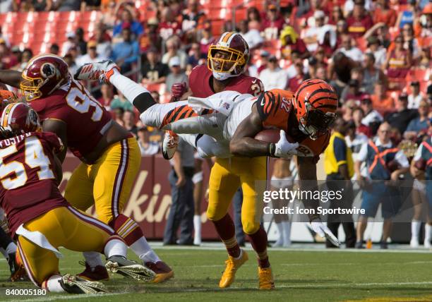 Cincinnati Bengals runningback Jeremy Hill goes airborne to score a one yard touchdown in the 1st quarter during the NFL preseason game between the...