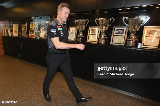 Magpies head coach Nathan Buckley arrives during a Collingwood Magpies AFL press conference at the Holden Centre on August 28, 2017 in Melbourne,...