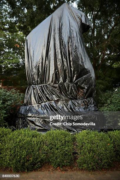 The statue of Confederate Gen. Stonewall Jackson that stands in the center of Justice Park is shrouded in black plastic August 27, 2017 in...
