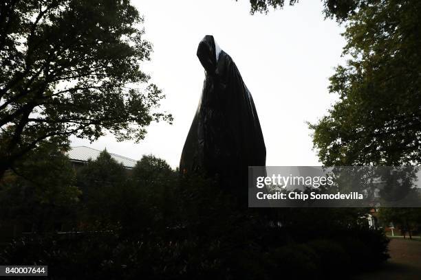 The statue of Confederate Gen. Stonewall Jackson that stands in the center of Justice Park is shrouded in black plastic August 27, 2017 in...