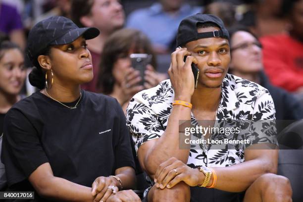 Player Russell Westbrook of the Oklahoma City Thunder and his wife Nina Earl attends the Minnesota Lynx vs the Los Angeles Sparks during a WNBA...