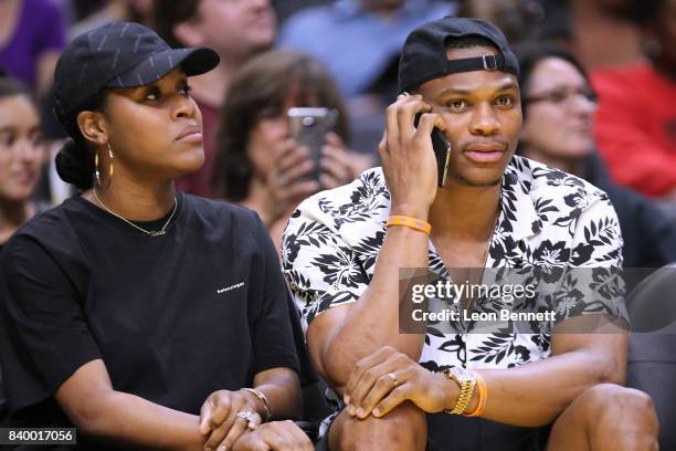 Player Russell Westbrook of the Oklahoma City Thunder and his wife Nina Earl attends the Minnesota Lynx vs the Los Angeles Sparks during a WNBA...