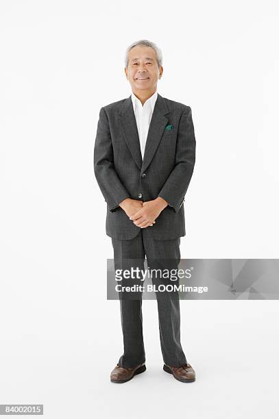 portrait of senior businessman, studio shot - asian man studio shot stock pictures, royalty-free photos & images