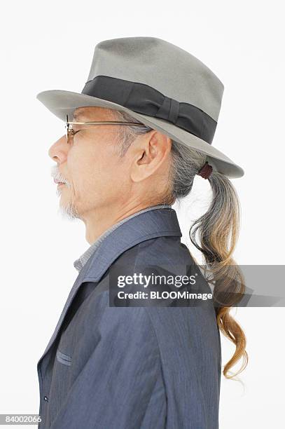 portrait of senior man, side view, close-up, studio shot - portrait close up loosely stock pictures, royalty-free photos & images