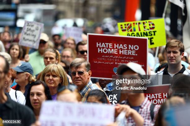 Demonstrator holds a banner reading "Hate Has No Home Here" during a protest against racism and hate in Chicago, United States on August 27, 2017....