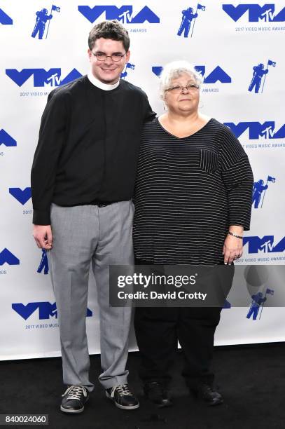 Rev. Robert Wright Lee IV and Susan Bro pose in the press room during the 2017 MTV Video Music Awards at The Forum on August 27, 2017 in Inglewood,...