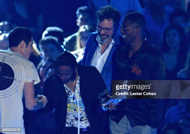 Kendrick Lamar accepts the Best Hip Hop award for 'Humble' onstage with Dave Meyers and Dave Free during the 2017 MTV Video Music Awards at The Forum...