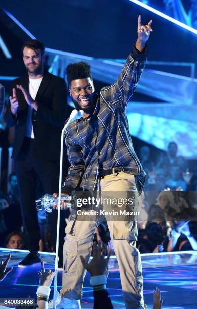 Singer/songwriter Khalid accepts award onsstage during the 2017 MTV Video Music Awards at The Forum on August 27, 2017 in Inglewood, California.