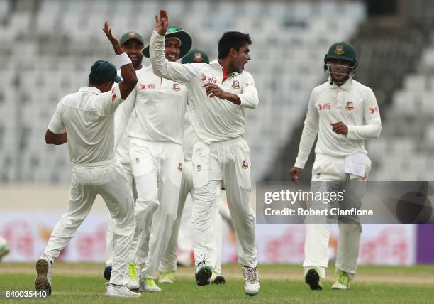 Mehedi Hasan Miraj of Bangladesh celebrates taking the wicket of Steve Smith of Australia during day two of the First Test match between Bangladesh...