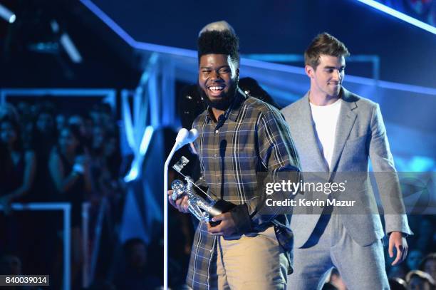 Singer/songwriter Khalid accepts award onsstage during the 2017 MTV Video Music Awards at The Forum on August 27, 2017 in Inglewood, California.