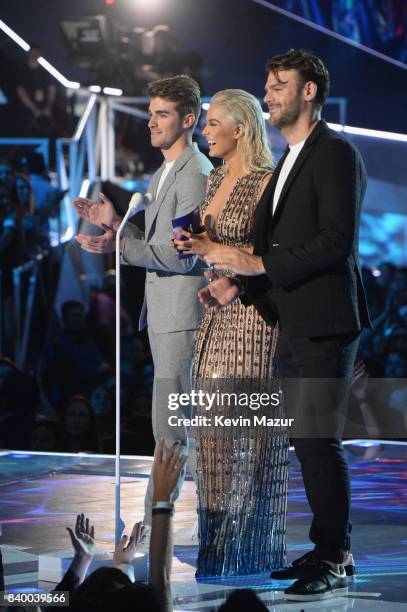 Andrew Taggart and Alex Pall of the Chainsmokers with Bebe Rexha speak onstage during the 2017 MTV Video Music Awards at The Forum on August 27, 2017...