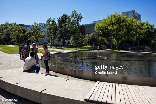 in front of a fountain in ubc, vancouver, canada - university of british columbia stock pictures, royalty-free photos & images