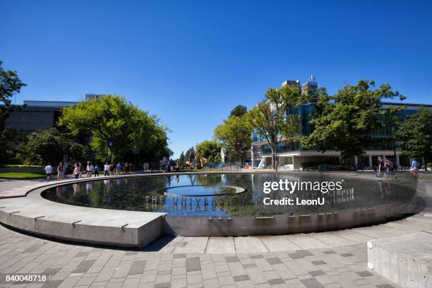 in front of a fountain in ubc, vancouver, canada - university of british columbia stock pictures, royalty-free photos & images