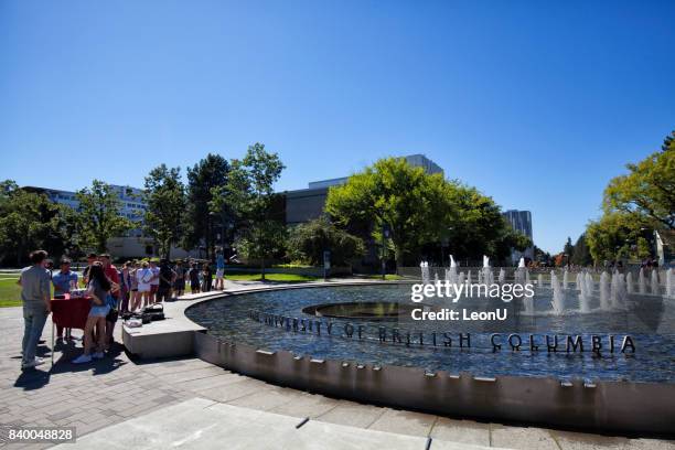 in front of a fountain in ubc, vancouver, canada - university of british columbia stock pictures, royalty-free photos & images