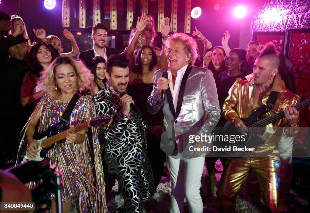 JinJoo Lee and Joe Jonas of DNCE, Sir Rod Stewart Cole Whittle of DNCE perform during a pre-taping for the 2017 MTV Video Music Awards at the Palms...