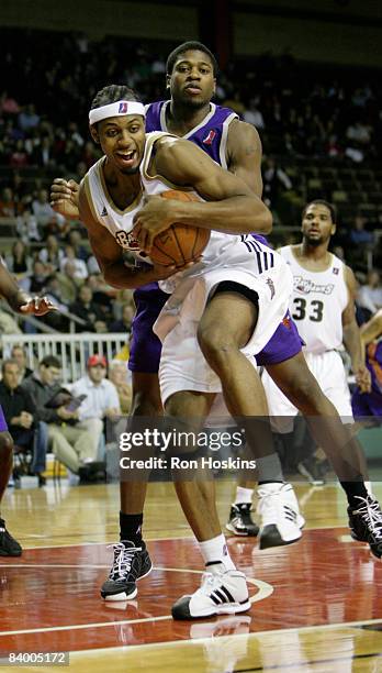 Ivan Harris of the Erie BayHawks rebounds over Cartier Martin of the Iowa Energy at Tullio Arena on December 11, 2008 in Erie, Pennsylvania. The...