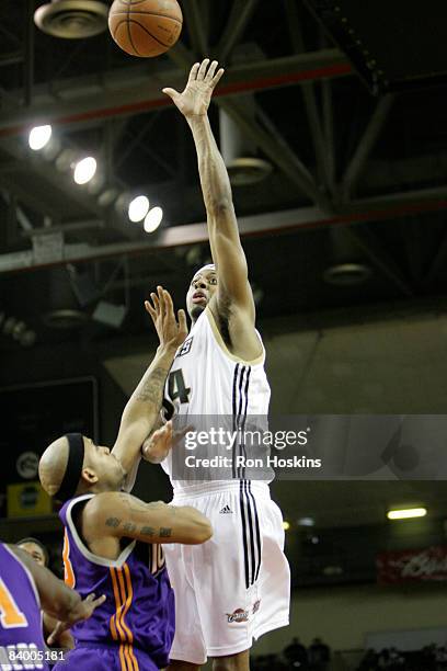 Ivan Harris of the Erie BayHawks shoots over a Iowa Energy defender at Tullio Arena on December 11, 2008 in Erie, Pennsylvania. The BayHawks defeated...