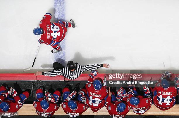 Andrei Kostitsyn of the Montreal Canadiens skates across the blue line as linesman Derek Amell signals the play onside in a game against the Tampa...