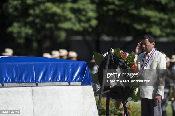 Philippine President Rodrigo Duterte salutes at the Tomb of the Unknown Soldier during a ceremony on National Heroes' Day at the Heroes Cemetery in...