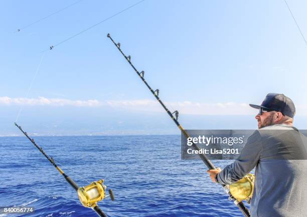 man fishing - deep sea fishing stock pictures, royalty-free photos & images