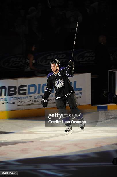 Dustin Brown of the Los Angeles Kings skates on the ice after being named the star of the game for his first career hat trick during the game against...