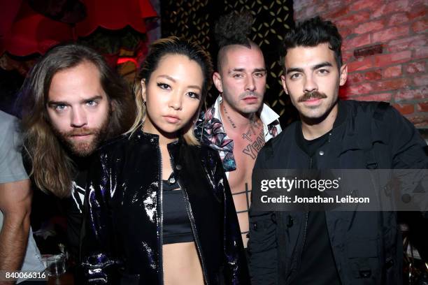 Jack Lawless, JinJoo Lee, Cole Whittle, and Joe Jonas of DNCE at Republic Records VMA Party presented in partnership with FIJI Water at TAO at the...