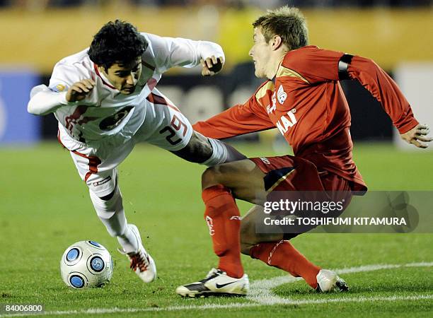 New Zealand's Waitakere United midfielder Pimenta is fouled by Australia's Adelaide United defender Scott Jamieson during the FIFA Club World Cup...