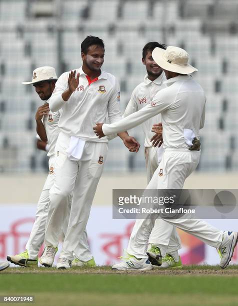 Shakib Al Hasan of Bangladesh celebrates taking the wicket of Glenn Maxwell of Australia during day two of the First Test match between Bangladesh...