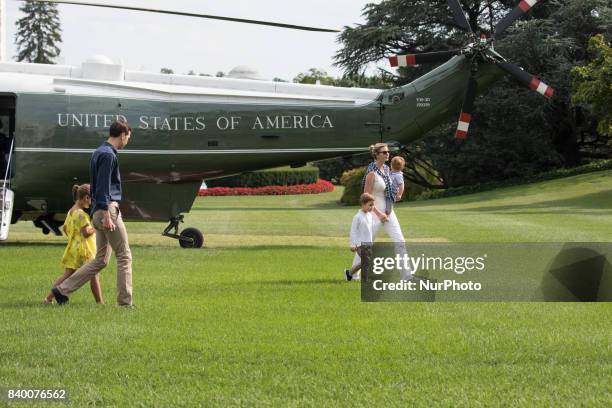 White House advisors Jared Kushner and Ivanka Trump with their children, 6-year-old Arabella, 3-year-old Joseph, and 1-year-old Theodore, walk across...