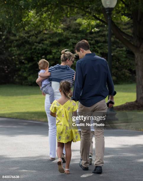 White House advisors Jared Kushner and Ivanka Trump with their children, 6-year-old Arabella, 3-year-old Joseph, and 1-year-old Theodore, walk across...