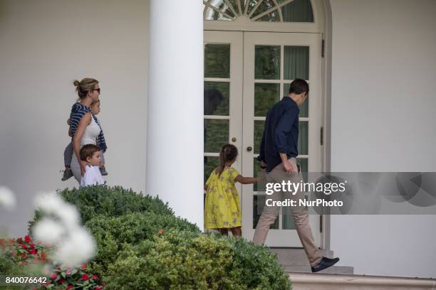 White House advisors Jared Kushner and Ivanka Trump with their children, 6-year-old Arabella, 3-year-old Joseph, and 1-year-old Theodore, walk...