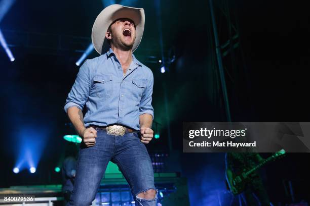 Country music singer Justin Moore performs on stage during the Hometown Throwdown festival hosted by 100.7 The Wolf at Enumclaw Expo Center on August...