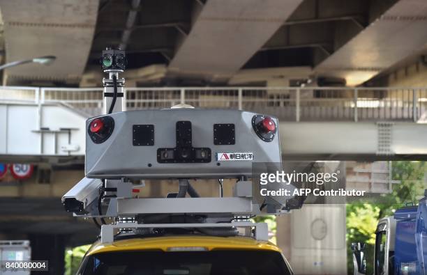 This photo taken on June 5, 2017 shows the top of the "Infra Doctor" vehicle being used by the Tokyo highway inspection system in Tokyo. Japan is...