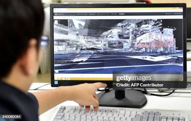 This photo taken on June 5, 2017 shows a computer screen displaying a 3D image using the data collected by the "Infra Doctor" vehicle in Tokyo. Japan...