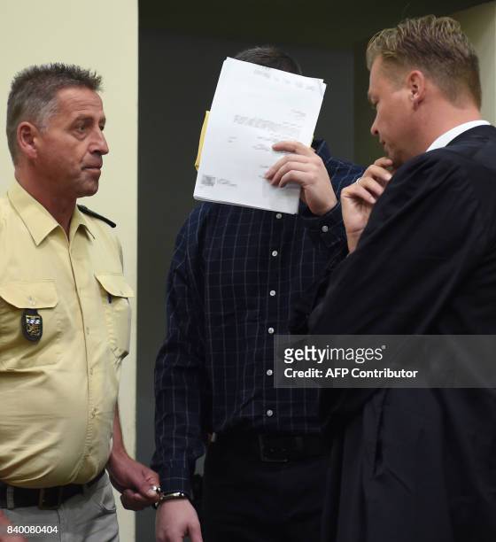 The defendant Philipp K. Arrives with his lawyer Sascha Marks in the court room at the country court in Munich, southern Germany, on August 28, 2017....