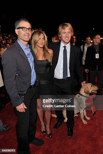 Director David Frankel, actress Jennifer Aniston, actor Owen Wilson and Clyde attend the "Marley & Me" premiere at the Mann Village Theater on...