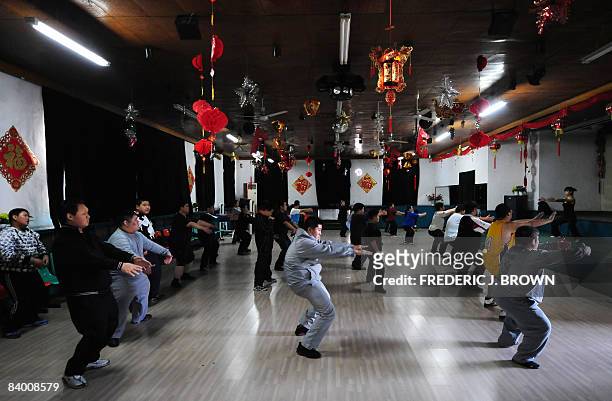 By Marianne Barriaux Patients follow the lead of an instructor during an hour long aerobics session at a weight reduction clinic in Tianjin on...