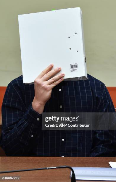 The defendant Philipp K. Waits in a court room prior his trial at the country court in Munich, southern Germany, on August 28, 2017. One year after...