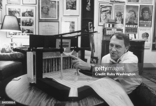 American theatre producer and director Joseph Papp in his office with a model of the set for his production of Shakespeare's 'A Midsummer Night's...