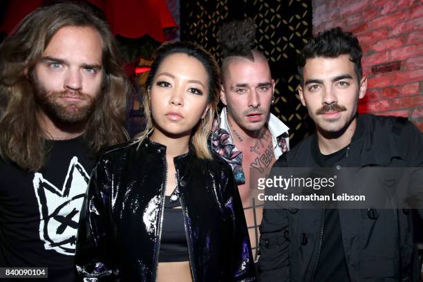 Jack Lawless, JinJoo Lee, Cole Whittle, and Joe Jonas of DNCE at Republic Records VMA Party presented in partnership with FIJI Water at TAO at the...